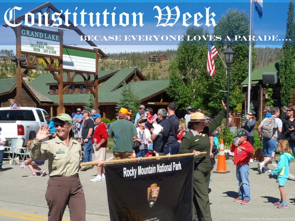 Slide 4 - Picture of the Constitution Week Parade of the Rangers from the Rocky Mountainal National Park taken in Grand Lake, Colorado - Now with text that would indicated that everyone loves a parade.