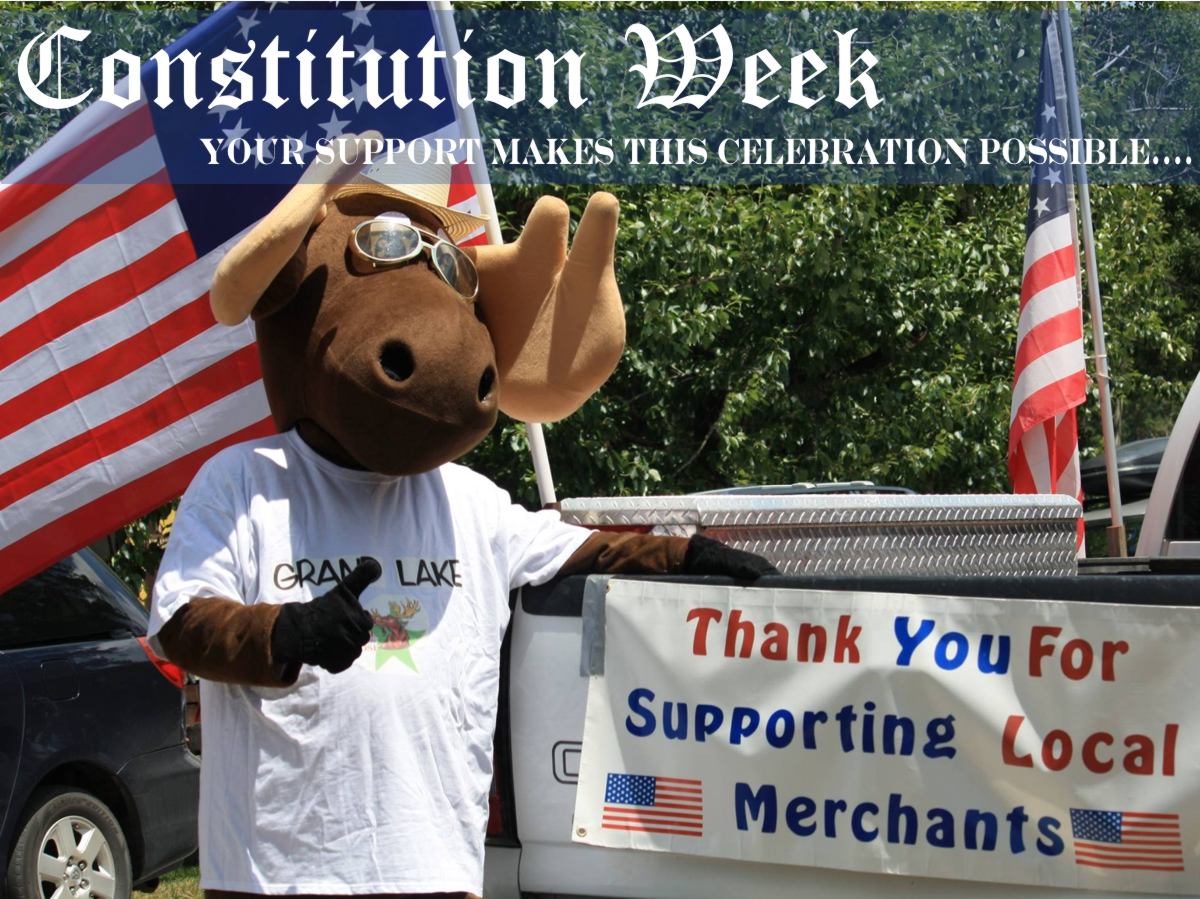 Slide 10 - Picture of the town mascot Bruce the Moose in support of our local merchants taken in Grand Lake, Colorado - Now with text that asks for everyone to support our local merchants.