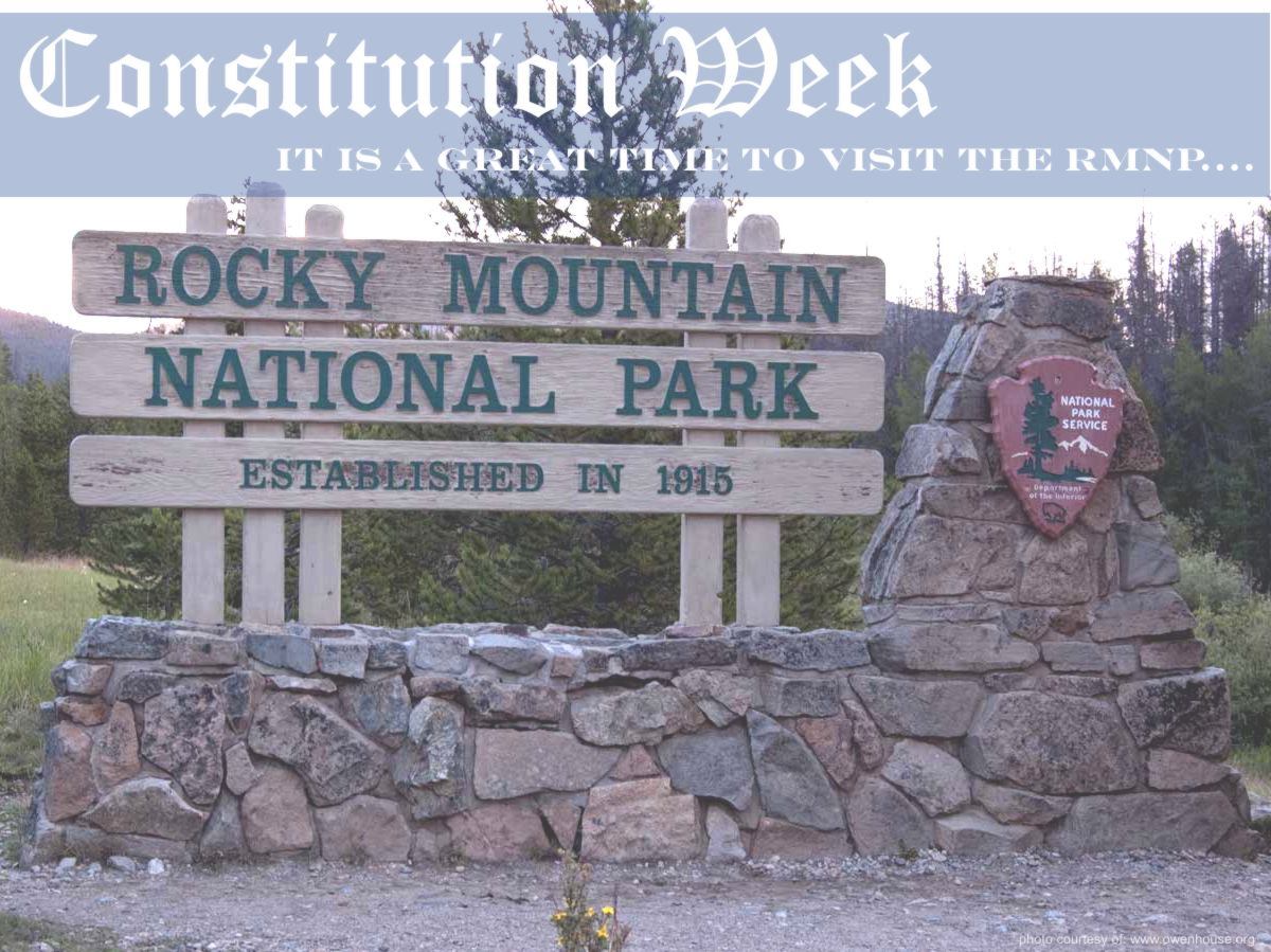 Slide 14 - Picture of the Rocky Mountain National Park Sign taken just outside Grand Lake, Colorado. - Now with text supporting Constitution Week and that this is a good time to visit the Rocky Mountain National Park.
